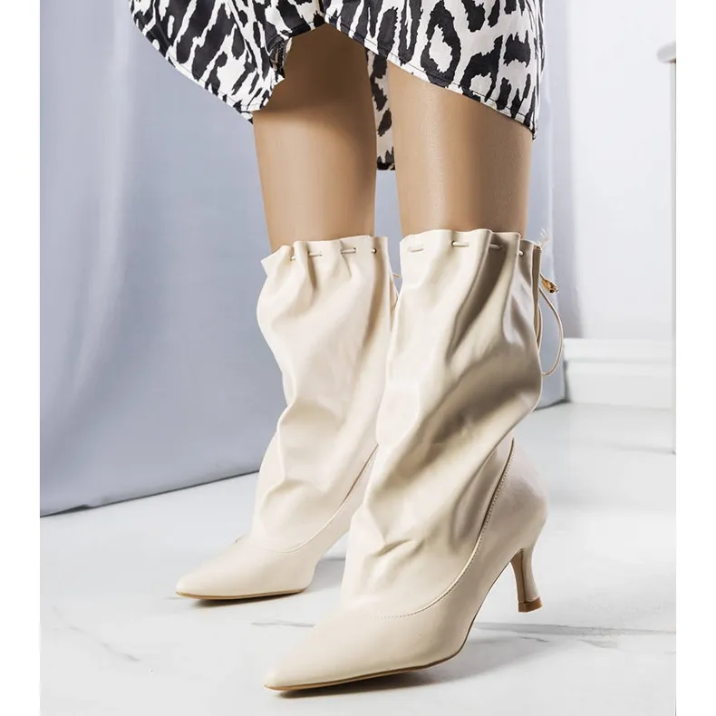 Beige low heel boots from Jabari