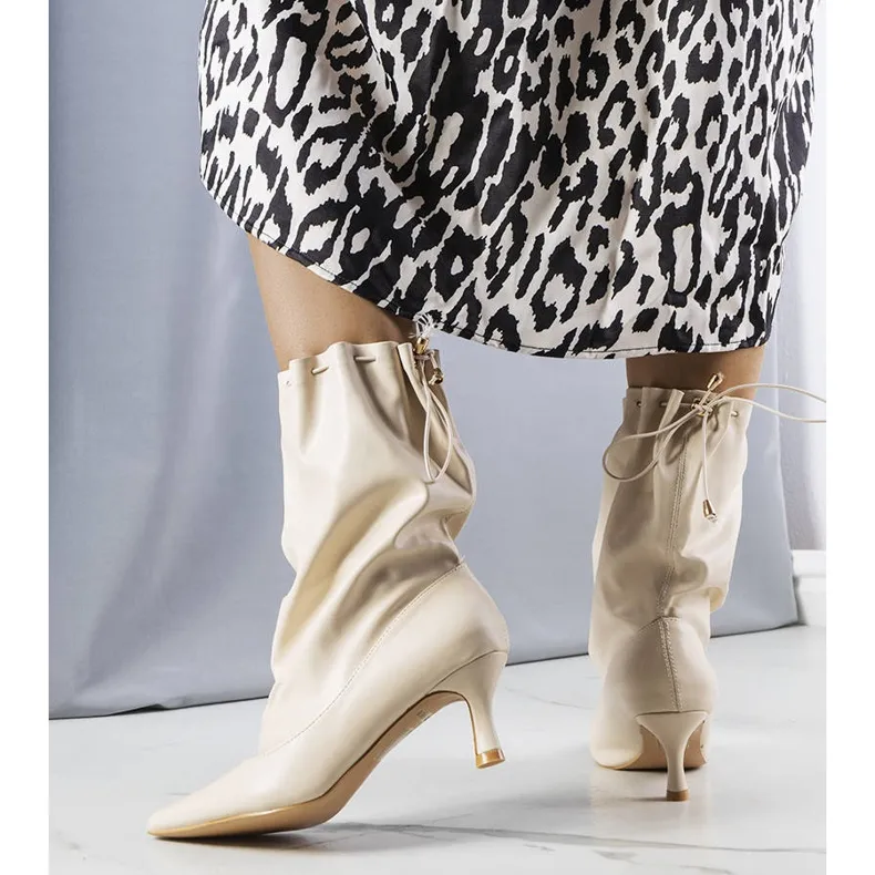 Beige low heel boots from Jabari